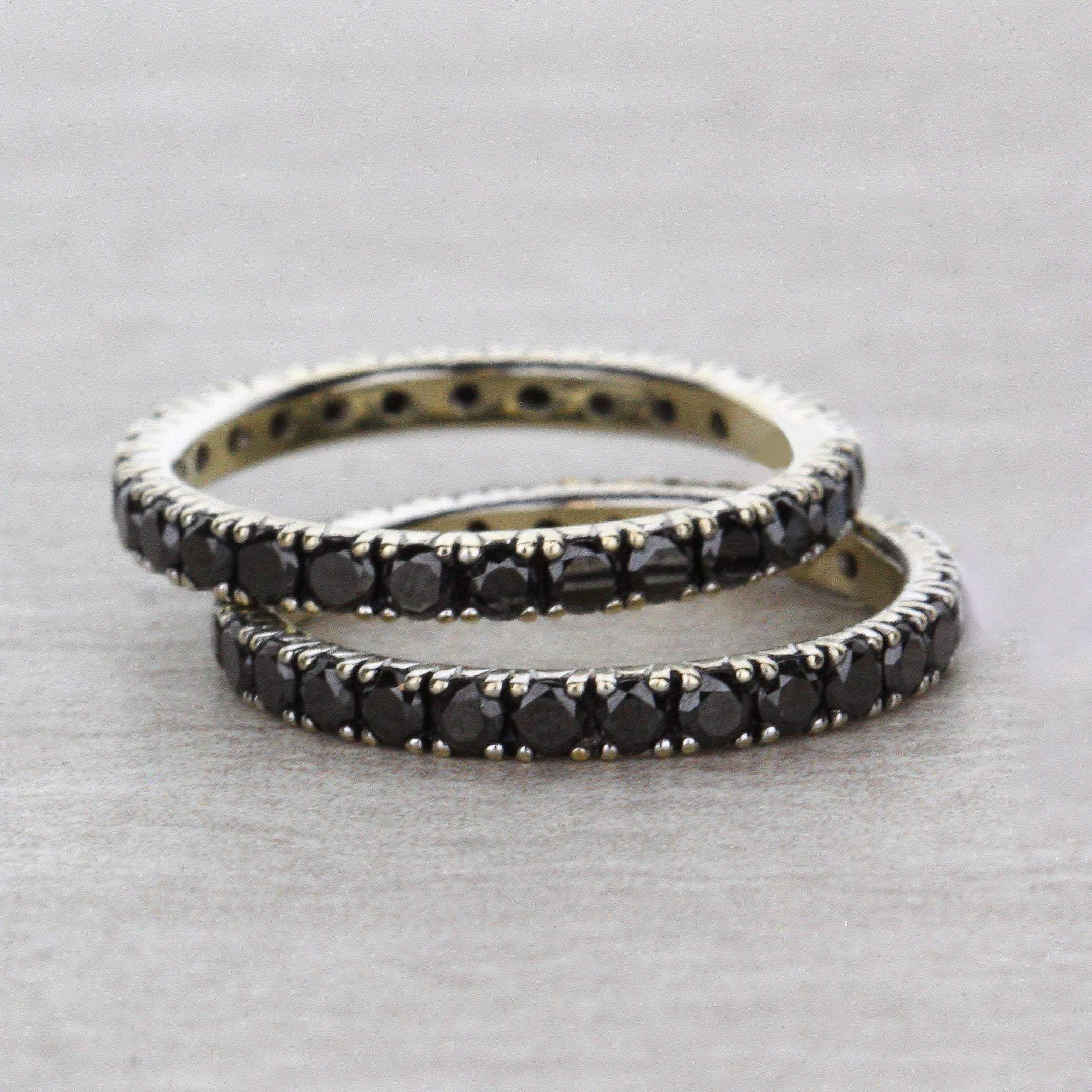 two black diamond eternity bands